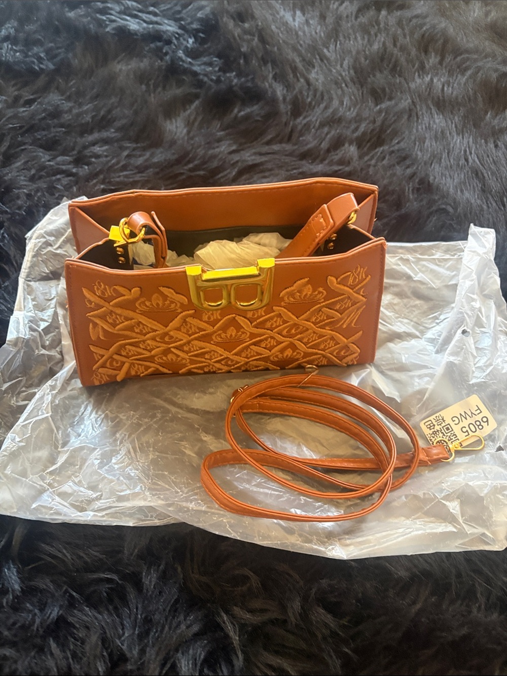Stylish Embossed Orange Crossbody Bag with Gold Hardware